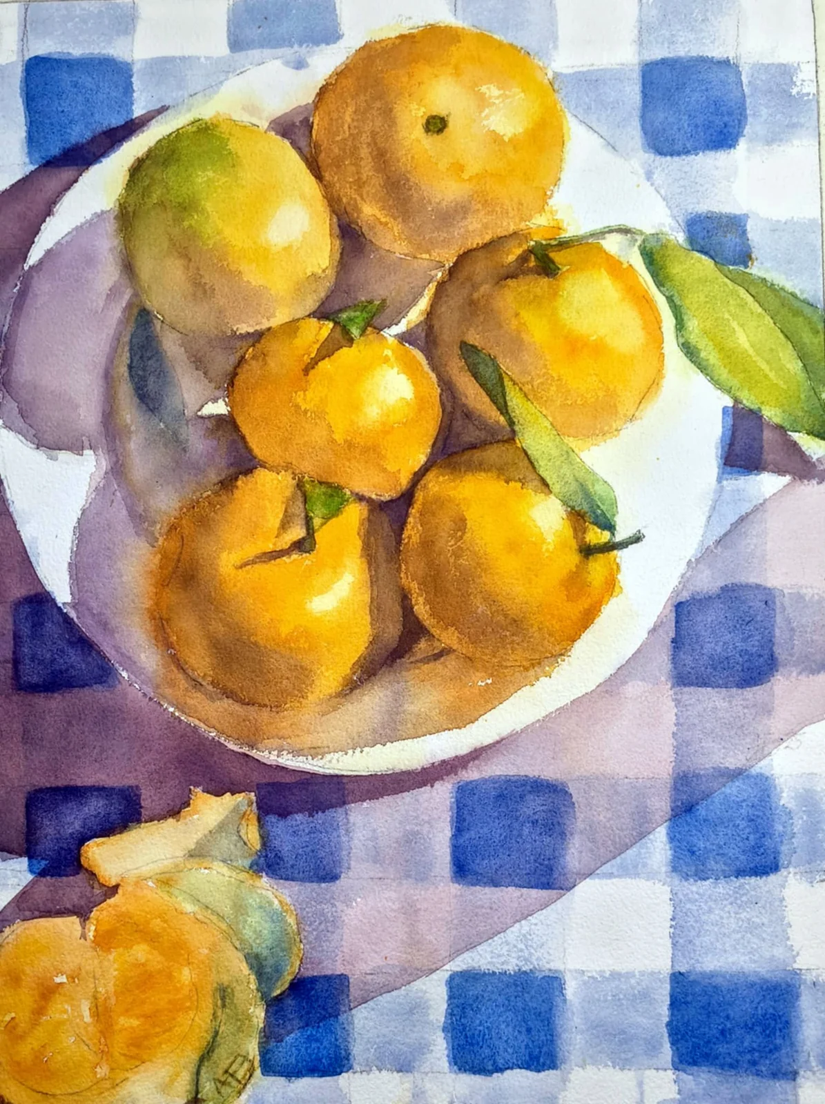 Stilleben med citrusfrugter på en blåternet dug